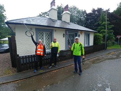 Litter pickers on Bestwood Lodge Drive on a wet day