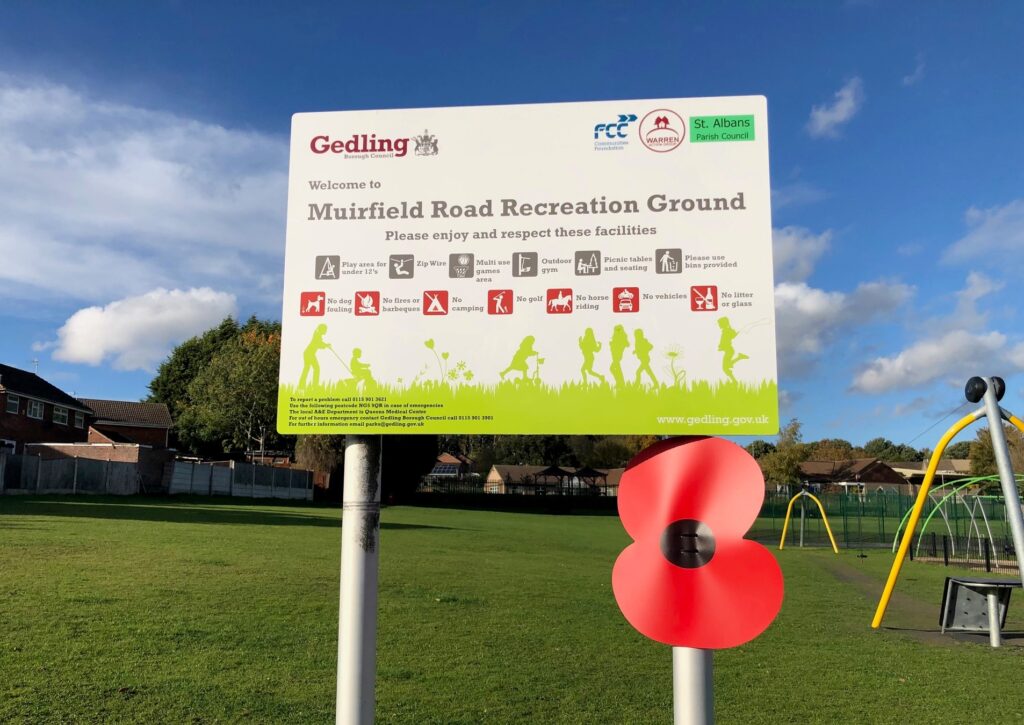 Poppies on lamp-post near Muirfield Park